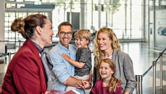 Family of four checking in at Munich Airport