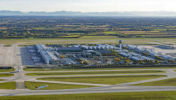 Aerial view of Munich Airport with an LH aircraft taking off