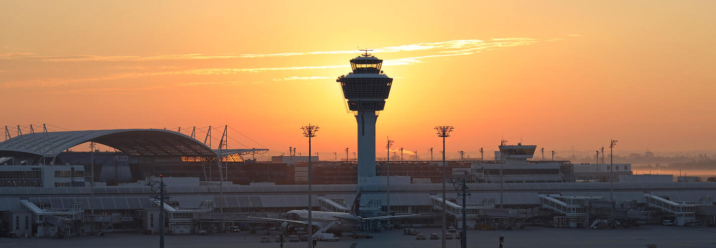 Panoramic view on Munich Airport Tower and apron at Munich Airport at sunrise