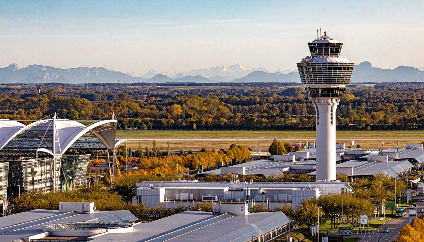 Munich Airport Alpine Panorama Tower and terminal building of Munich Airport against the backdrop of the Alps.